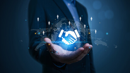 Businessman hand presents a holographic global partnership concept. network of organizations to create value, partnerships, Business collaboration strategies, suppliers, and other stakeholders.