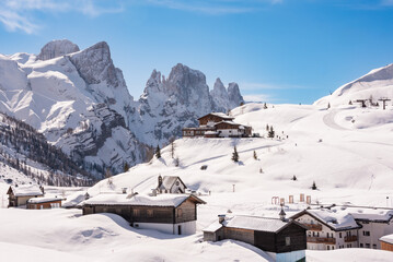Winter mountain landscape and houses in Dolomite alps, Italy