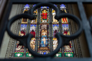 Stained glass window inside the Basilica of San Petronio, Bologna, Italy © cabuscaa