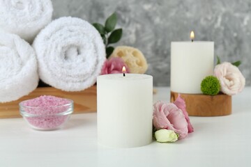 Composition with different spa supplies on white table