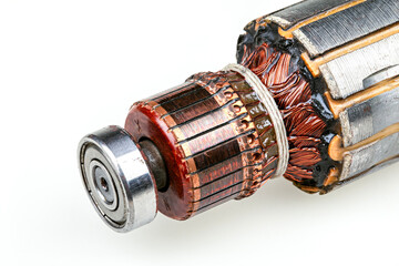 Closeup of old electric motor rotor with copper coils. Commutator with copper brush contacts,...