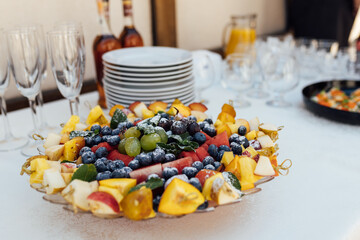 Wedding party. Buffet table with vegetables and fruits.