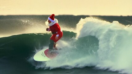 Santa surfing the waves on a beach at sunset, showcasing winter fun and holiday spirit in a unique ocean view