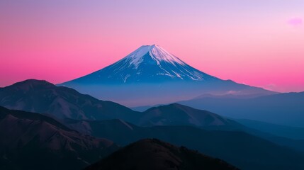 Majestic Mount Fuji stands tall against a vibrant pink sunset sky.