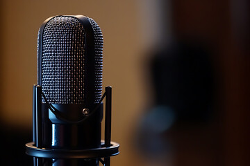 A modern stylized microphone featuring a sleek and elegant design