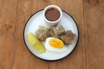 siomay. traditional indonesian food with peanut sauce. dumpling
