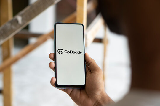 Dhaka, Bangladesh- 13 Oct 2024: GoDaddy logo is displayed on smartphone.
