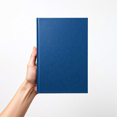 Obraz premium Hand Holding a Blue Hardcover Book on White Background