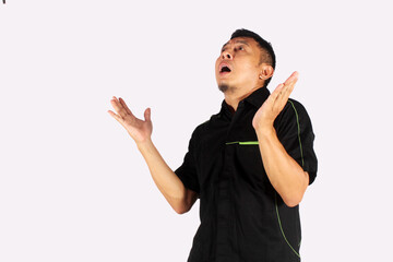 An Asian adult man opens both hands with an open mouth expression, for business and food advertising.