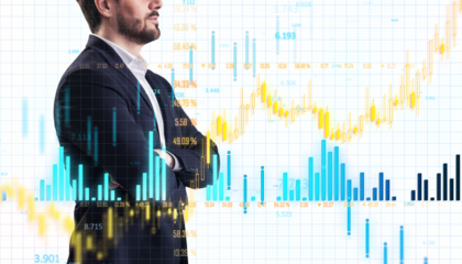 Man in suit with stock market chart overlay, white background, growth concept