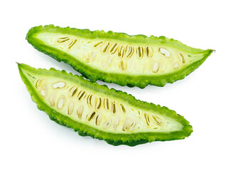 slices of bitter gourd arranged on white background