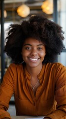 Fototapeta premium A friendly professional Black woman smiles warmly in a modern office environment