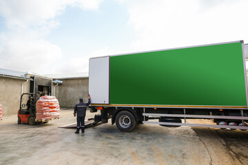 Forklift Loading Mesh Bags of Fresh Onion into the Truck