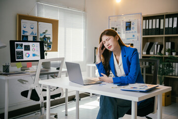Stressed asian businesswoman in modern office, tired and overwhelmed by work, facing deadline...