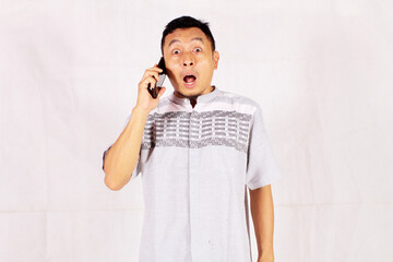 young businessman confused and serious while making a phone call
