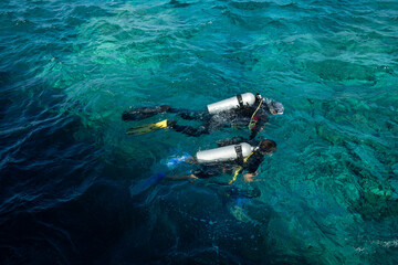Scuba diver on the water surface