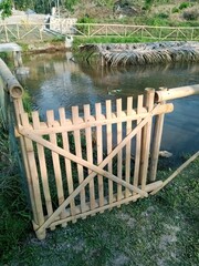 wooden bridge over the fond fish