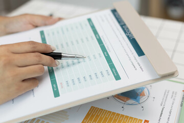 The executives are reviewing the information in the important documents