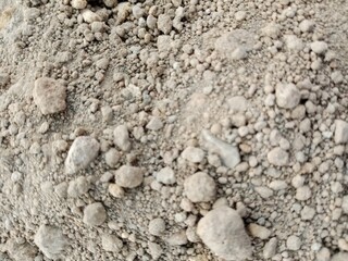 texture of stone, pebbles in dry soil