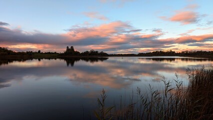 Beautiful orange sunset lakeside landscape scenery at Ross lake, Roscahill, Galway, Ireland, nature background