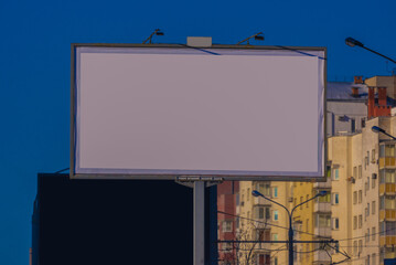 Billboard along the road and highway on a winter snow day. Background for design and advertising. 