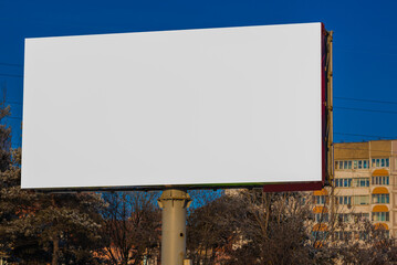 Billboard along the road and highway on a winter snow day. Background for design and advertising. 