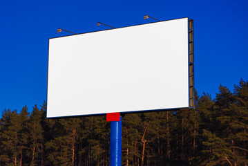 billboard along the highway on a winter snow day. Background for design and advertising. 