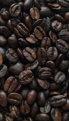 The image features coffee beans in various shades of brown, closely arranged together.