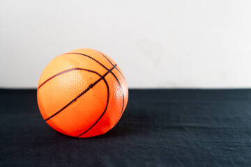 Orange Basketball on Black Surface