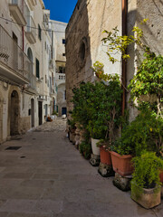Narrow street in the old town center. Architecture of historic tenement houses in an Italian town. Bari, Puglia, Italy.