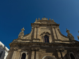 Elevation of buildings in a narrow street in the center of the old town. Bari, Italy.