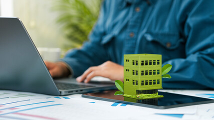 Businessman plans to prepare sustainable green building. environmentally friendly building. concept...