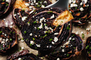 Baked red cabbage steaks with herbs and feta cheese