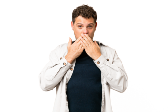 Brazilian man over isolated chroma key background covering mouth with hands