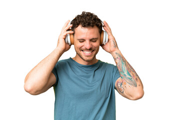 Brazilian man over isolated chroma key background listening music