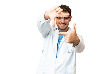 Brazilian doctor man over isolated chroma key background focusing face. Framing symbol