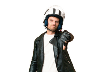 Brazilian man with a motorcycle helmet over isolated chroma key background showing thumb down with...