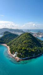 Sanya, Hainan paradise island. Aerial view of Phoenix Island from Luhuitou Park. Sanya bay. Excellent tourism destination for summer vacation by the sea. Popular Chinese resort isolated with white h