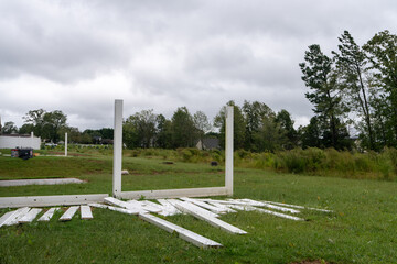 destroyed white fence on the ground