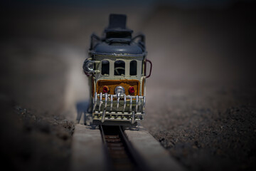 urban photography with the nostalgia and artistic urban charm of a miniature toy tram, ideal for...