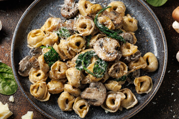 Chestnut Mushrooms and spinach tortellini served with parmesan cheese