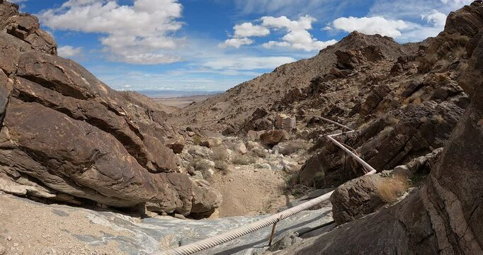 Timelapse of desert water collection system with clouds rolling past