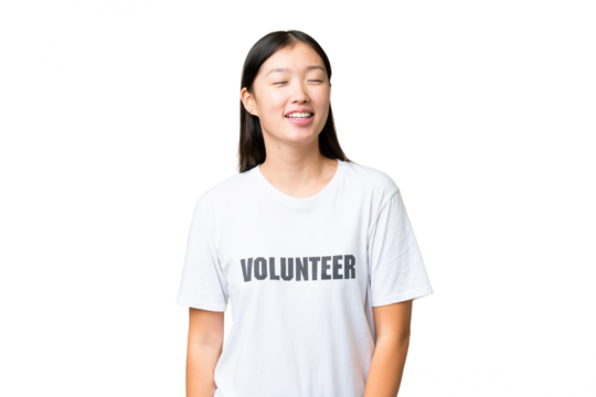 Young volunteer woman over isolated chroma key background laughing
