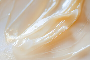 A smooth, glossy texture of highlighter spreads across a clean surface, reflecting light and creating a minimalistic aesthetic that enhances beauty and simplicity