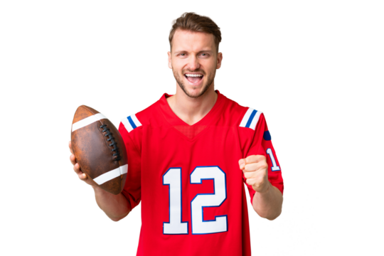 Young caucasian man playing rugby over isolated chroma key background celebrating a victory in winner position