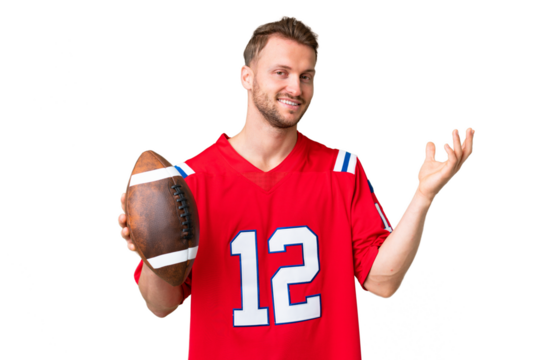 Young caucasian man playing rugby over isolated chroma key background extending hands to the side for inviting to come