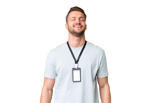 Young caucasian man with ID card over isolated chroma key background laughing