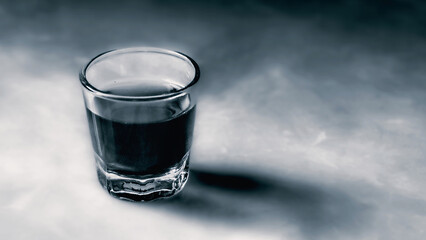 Iced americano is covered with fog, glass of water