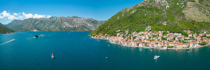 Aerial drone view of Perast city. Situated in Montenegro is a famous travel destination. View of Church of San Nicholas. Panoramic top view of costal city.