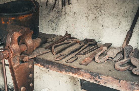 Old rusty tools on an old workbench